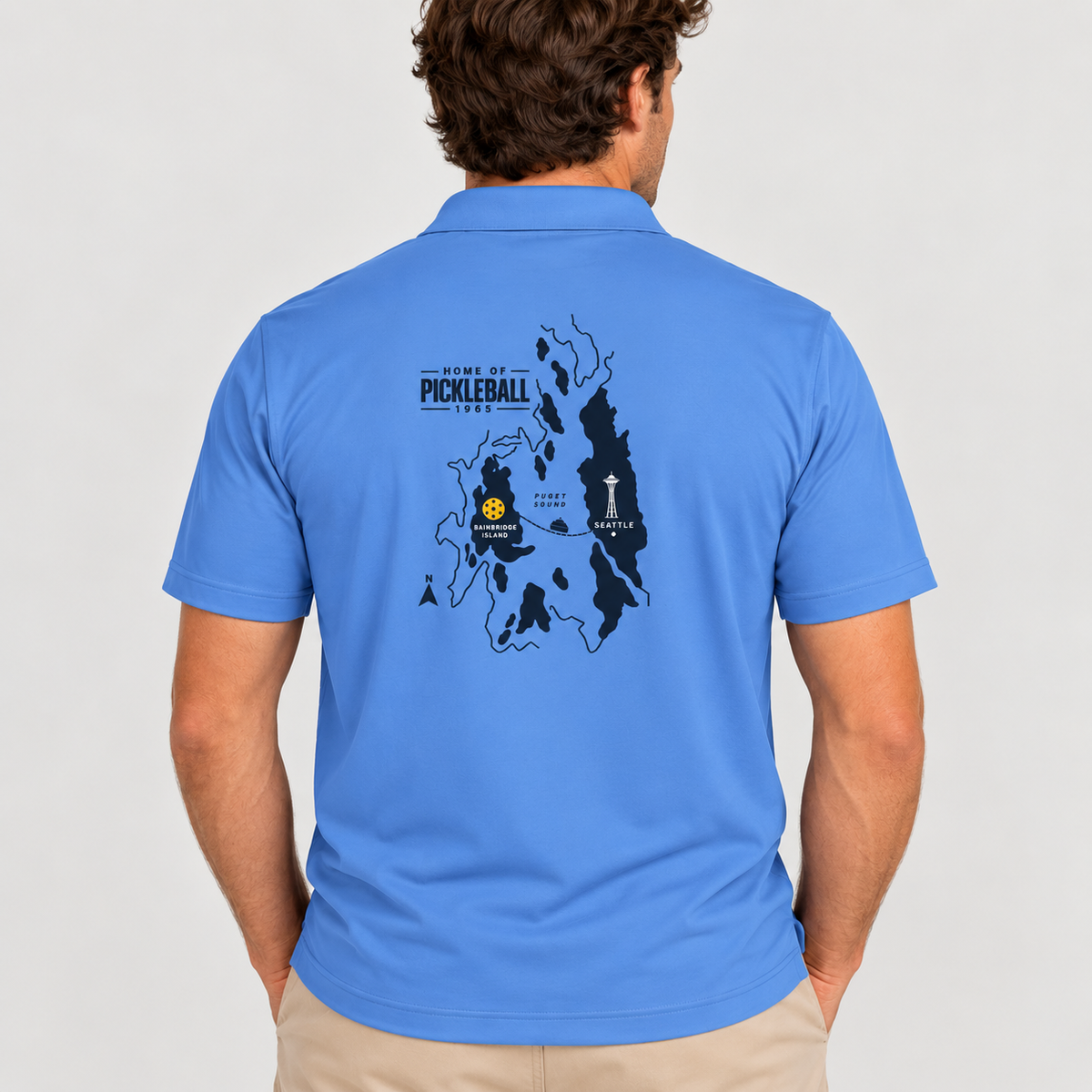 Bainbridge Island Home of Pickleball 1965 Men’s Performance Polo