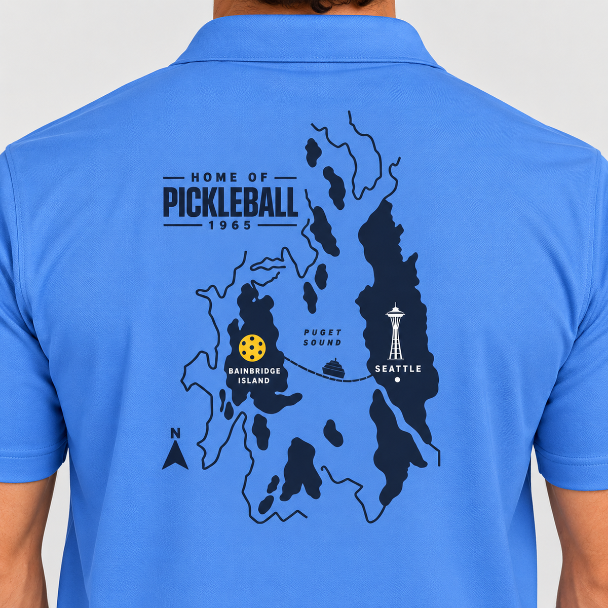 Bainbridge Island Home of Pickleball 1965 Men’s Performance Polo