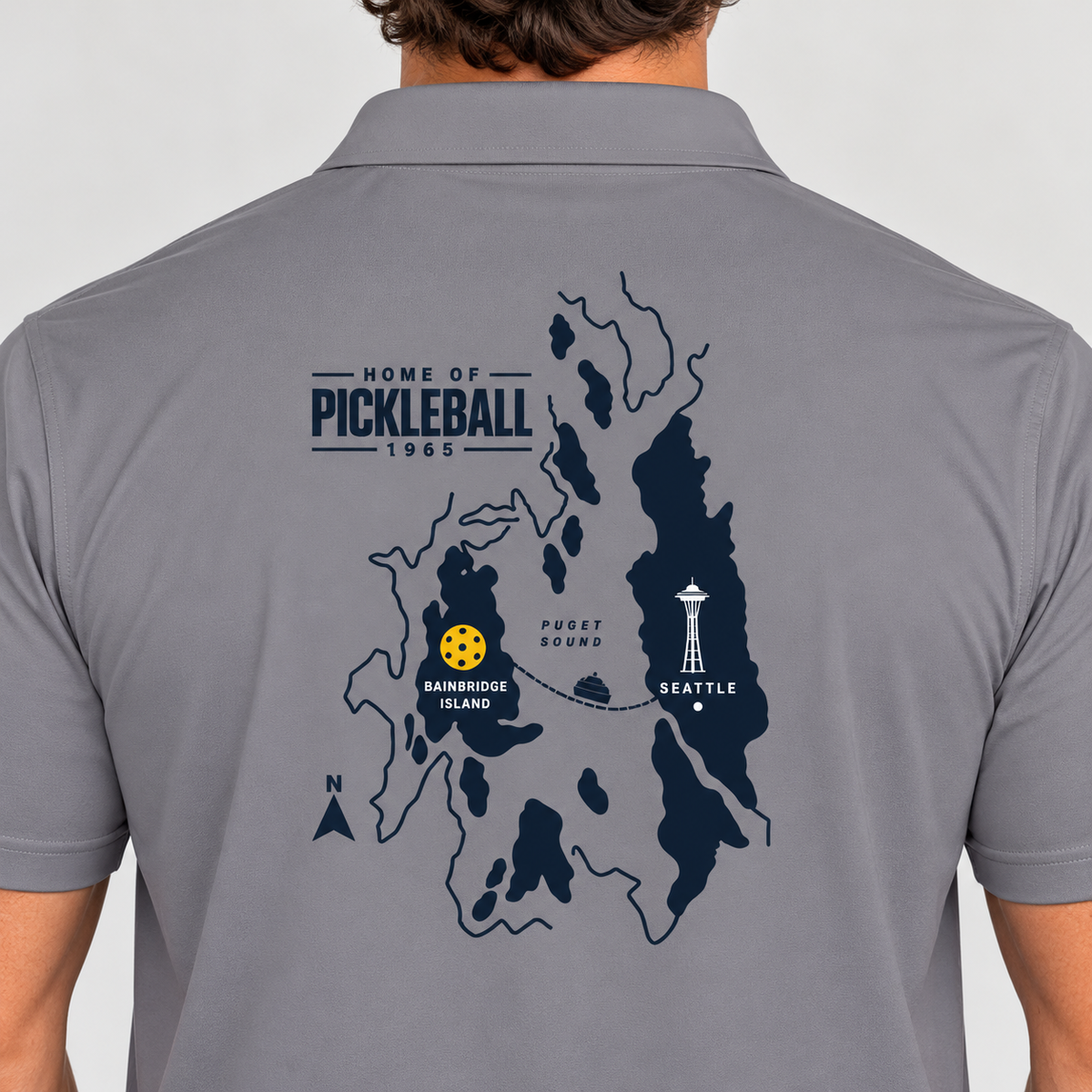 Bainbridge Island Home of Pickleball 1965 Men’s Performance Polo